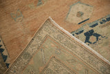 A folded corner on the vintage Hamadan rug reveals its hand-knotted back and low, sandalwood pile.