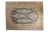 Distressed vintage Persian Meshed carpet with navy blue field, ivory floral bouquet design, 9'10