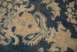 Distressed Persian Meshed carpet with navy blue and sand floral patterns; visible wear to foundation.
