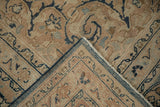 Distressed navy and beige hand-knotted pile, showing the Meshed carpet's foundation.