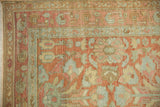 Evenly worn pile on a vintage Lilihan rug showing its terracotta and silver boteh borders.