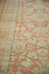 Soft, low pile texture of a vintage Lilihan runner with terracotta and silver floral motifs.