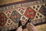 Overhead view of a vintage Serab runner's ruby red and sapphire blue diamond medallions.