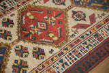Angled detail of a vintage Serab runner's red hexagonal medallion, colorful guls, and intricate borders.