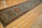Long perspective of the distressed Karaja runner's column of alternating medallions.
