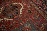 Low pile texture and geometric hook and latch motifs on a vintage Persian Karaja rug.