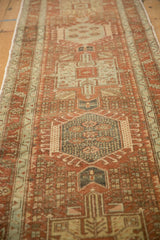 Angled view down the length of a distressed Karaja runner, showing its geometric medallion column.