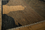 Corner of the Afghani carpet showing abstract checkered patterns and the hand-knotted side selvedge.