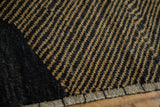 Close-up of the Afghani carpet's checkered design, textured pile, and original side cord.