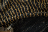 Hand-knotted foundation and checkered pile of a folded Afghani Moroccan design carpet.