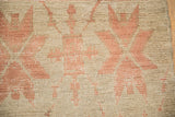 Low pile and visible knot heads on a distressed Turkish Oushak with blush patterns.