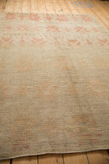 Heavy abrashes and a textured, low-pile surface on a vintage distressed Turkish Oushak carpet.
