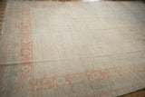 Low perspective across the carpet's platinum field showing its soft, distressed texture.