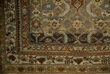 Geometric blossom and vine border of a distressed Persian runner in oxidized silver and rust.