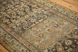 Traditional Herati motif and geometric vine border on a distressed vintage Hamadan rug runner.