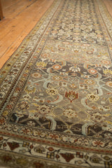 Perspective view down the distressed vintage runner highlights its repeating Herati motif.