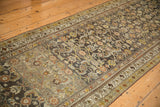 Angled perspective of a vintage Hamadan runner highlighting its intricate Herati pattern and decorative wear.