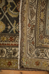Close-up of the hand-knotted construction and intact side cord selvage of a vintage Hamadan rug.