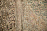 Detailed view of the distressed weave and knot heads on this vintage Sivas carpet's border.