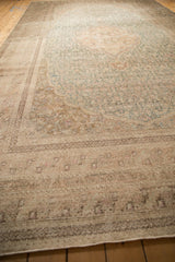 A long, low-angle view highlighting the heavy abrashes on the vintage Sivas carpet.