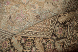 Close view of a distressed Sivas carpet's texture showing visible knot heads and heavy abrashes.