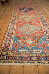 Serrated jade green medallion and floral motifs on an antique Persian runner.
