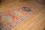Antique Northwest Persian runner detail: pomegranate stylized main border and threadbare selvage.