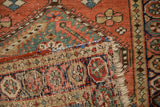 Antique Northwest Persian runner's hand-knotted foundation, secured selvage, and colorful fringe.