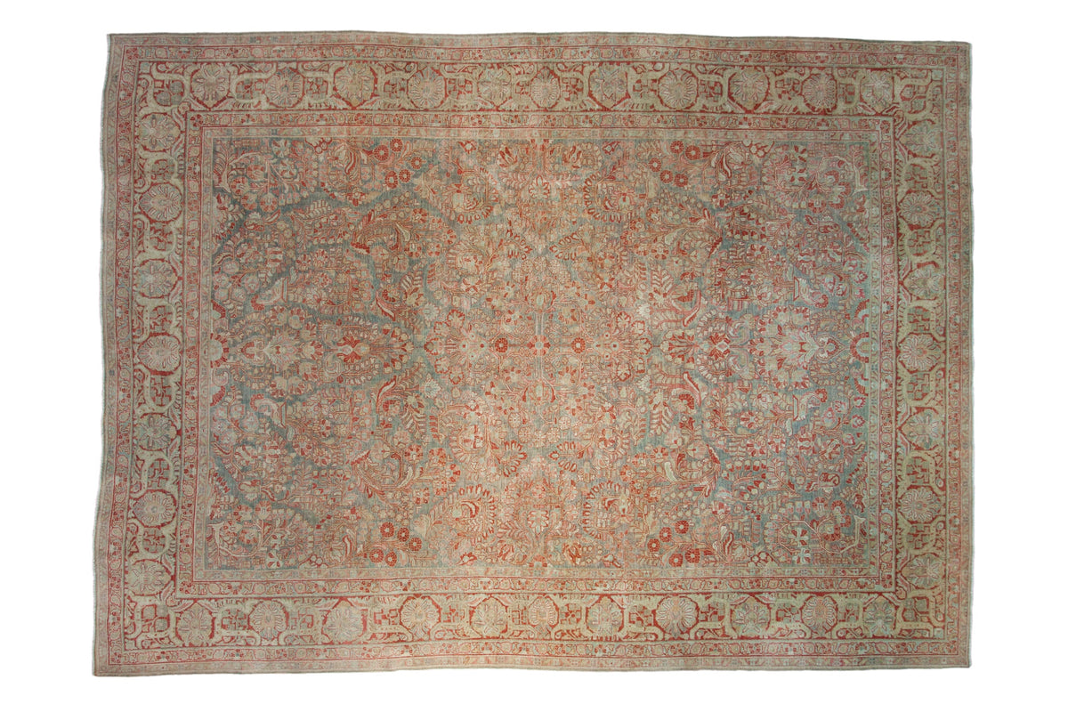 Antique distressed Sarouk carpet with allover floral and palmette border in slate blue, pomegranate.