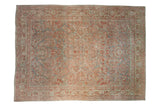 Antique distressed Sarouk carpet with allover floral and palmette border in slate blue, pomegranate.