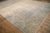 Distressed Sarouk carpet corner, showcasing the oversized palmette arabesque border and floral field.