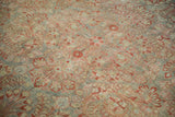 Distressed hand knotted Sarouk carpet field, floral sprays in slate blue and pomegranate red.