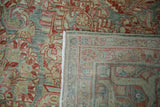 Distressed slate blue and red floral pile with hand-knotted Sarouk rug foundation.