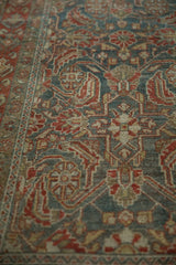 Angled view of the rug's low pile, highlighting the texture and knot heads of the Herati design.