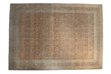 Distressed vintage Hereke carpet with coffee brown field, pale blue floral motif, and ornate arabesque border.