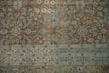 Distressed vine floral design with white knots and arabesque border in coffee brown and pale blue.