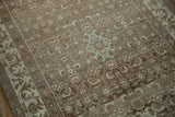 Mostly even wear showing the knot heads of a Herati motif in brown, ivory, and blue.