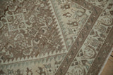 Distressed coffee brown pile showing mostly even wear down to the knot heads.