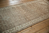 Low pile texture and powder blue abrashes on a distressed vintage Persian Hamadan runner.