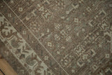 Close-up of the Herati motif on a distressed Hamadan runner with a low, textured pile.