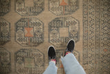 Even wear across the hand-knotted pile of a distressed Ersari carpet with geometric gul motifs.