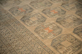 Detailed view of the even wear and geometric elephant footprint guls on a distressed Ersari carpet.