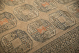 Even wear across knot heads on a distressed vintage Ersari carpet's repeating gul motifs.