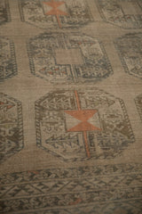 Low, evenly worn pile texture within the elephant footprint gul motif of a vintage Ersari carpet.