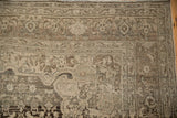 Worn pile on the corner spandrel and turtle design border of a vintage Bijar carpet.