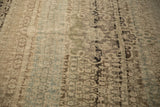 Heavy color abrashes across the even, low pile of a distressed vintage Bijar carpet.