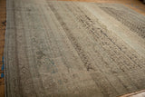 A vintage distressed Bijar rug showing heavy linear abrashes and an evenly worn, textured pile.