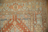 The Samovar and Herati border of a distressed Heriz runner in cherry red and powder blue.