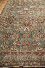 A long perspective view highlights the characterful wear on a vintage Mahal runner's floral field.