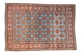 Distressed Persian Veramin carpet with an allover Mina Khani floral design in sapphire blue and cherry red.